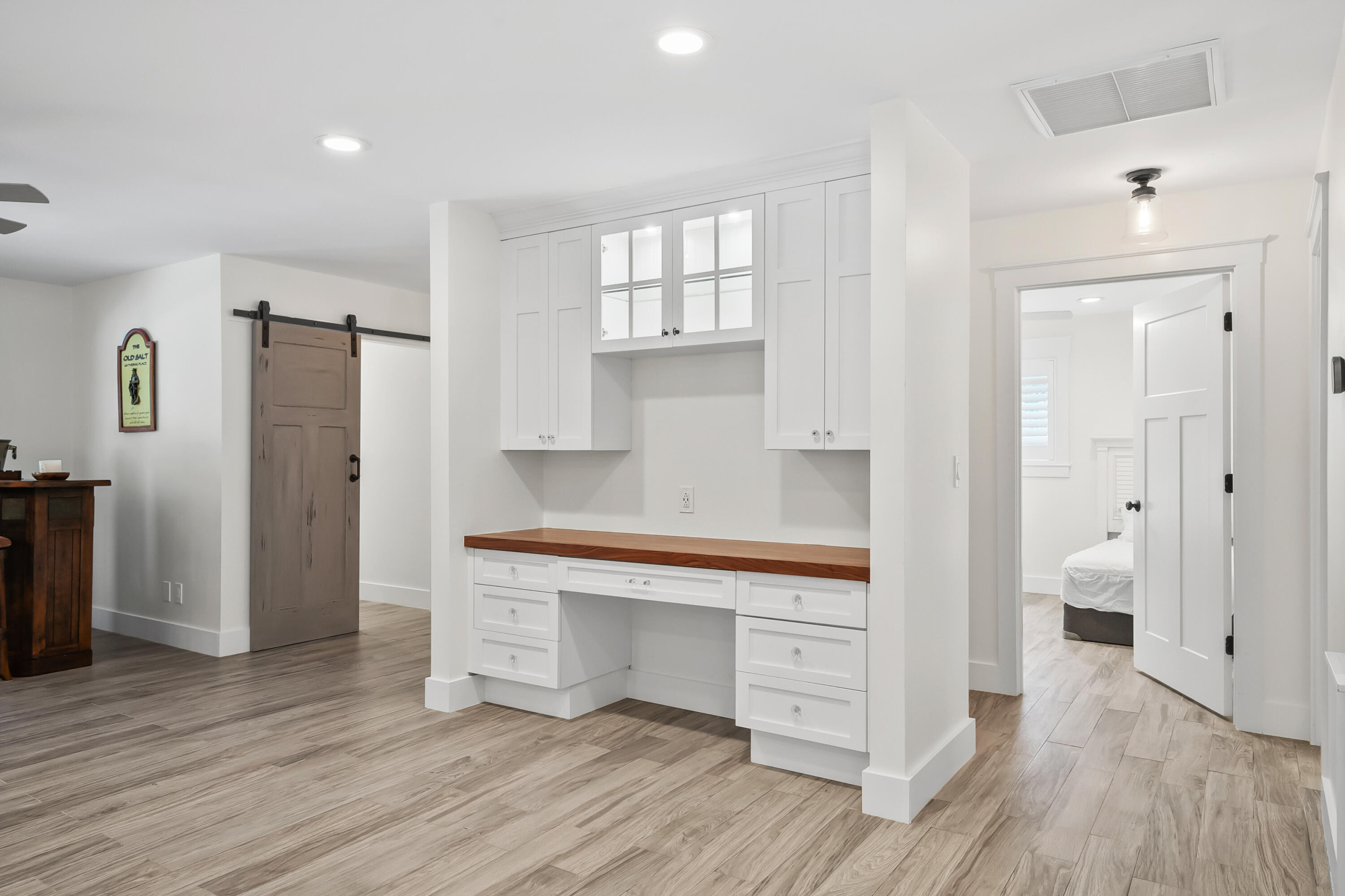 3 Mandalay Road Sewall's Point, FL 34996 - Photo 9 of 46 a room view with wooden floor and windows