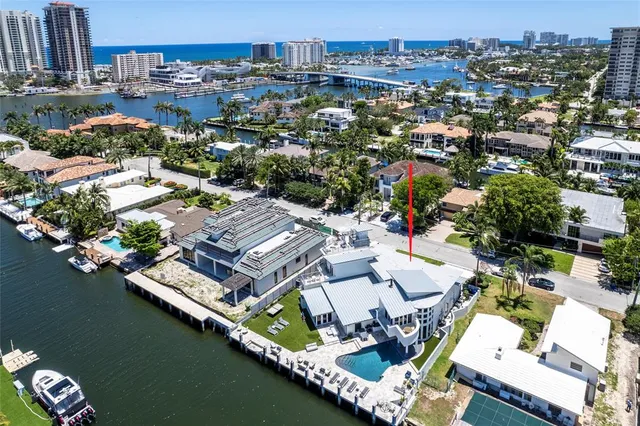 an aerial view of a house with a lake view