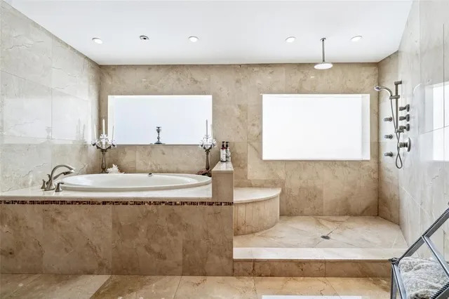 a living room with couches and kitchen view