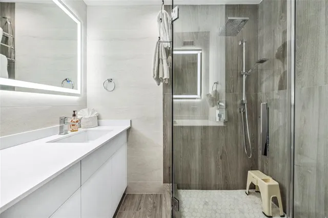 a bathroom with a sink and mirror