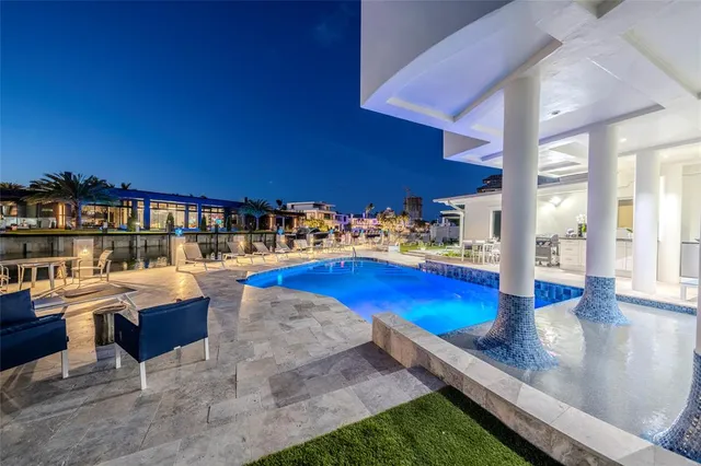 a dining room with furniture and a floor to ceiling window