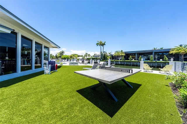 a view of a backyard with sitting area