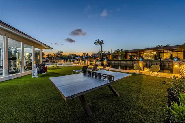 a view of a swimming pool with an outdoor space and seating area