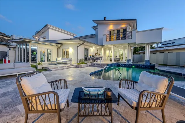a view of a patio with couches table and chairs