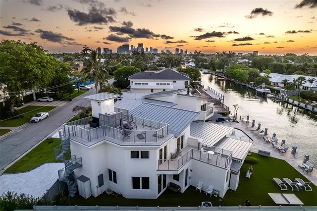 an aerial view of a house with a ocean view