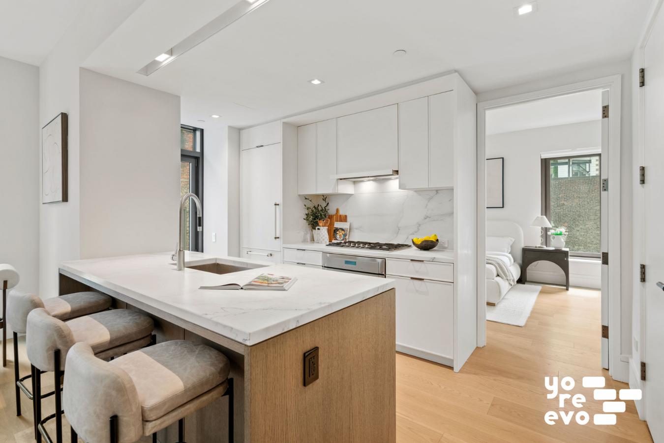 39 West 23rd Street, Unit 9B Manhattan, NY 10010 - Photo 4 of 16 a open kitchen with a sink a stove and white cabinets