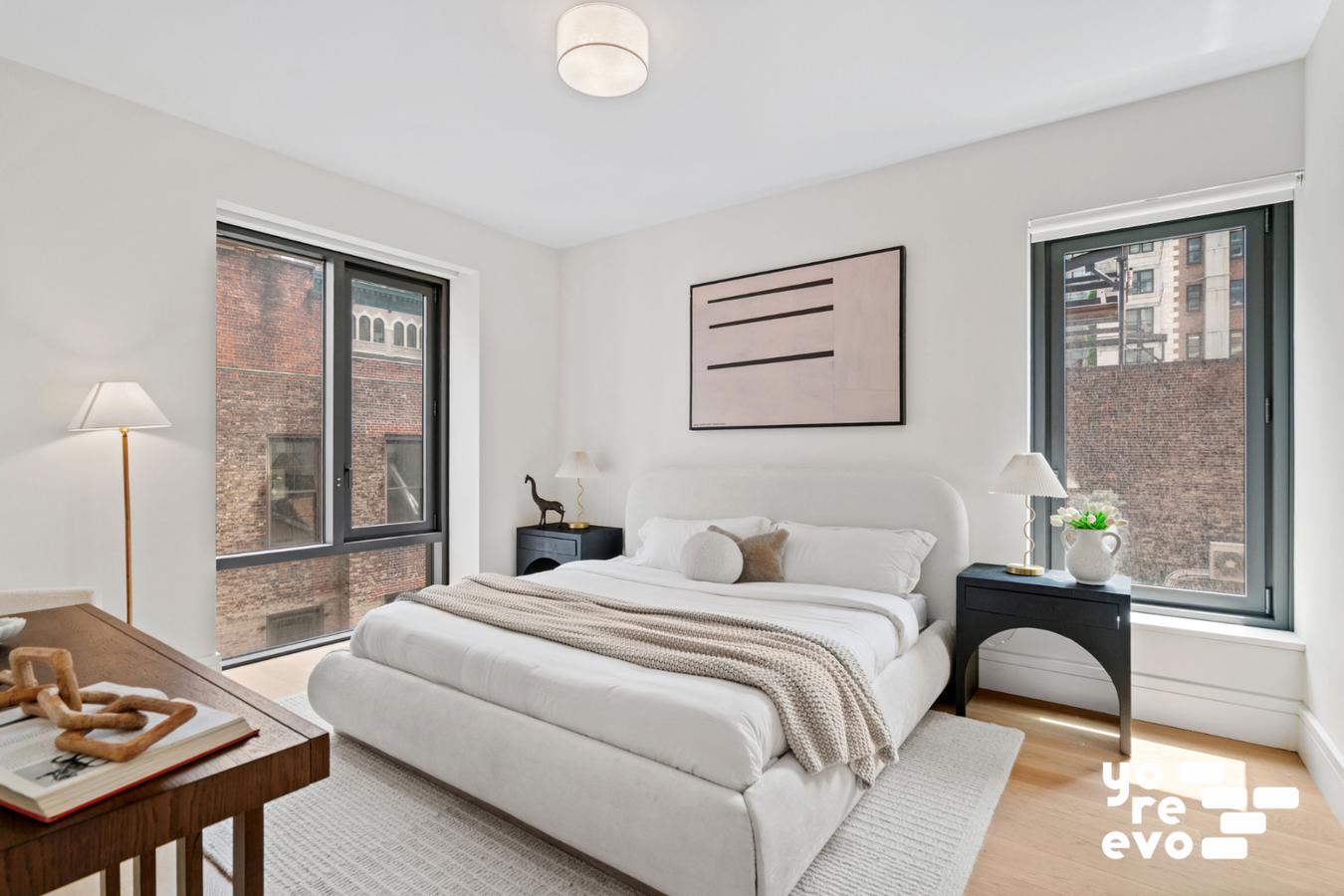 39 West 23rd Street, Unit 9B Manhattan, NY 10010 - Photo 6 of 16 a bedroom with a bed and a window