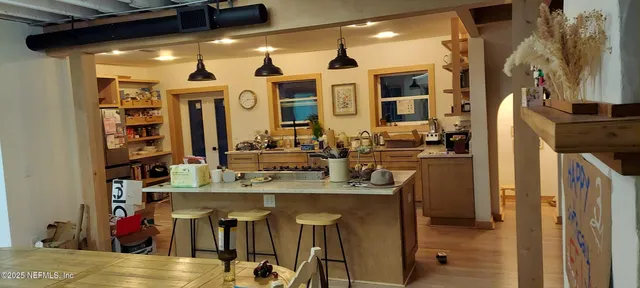 a view of a very nice looking dining room with a table and chairs