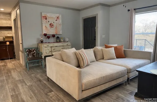 a living room with furniture and a window