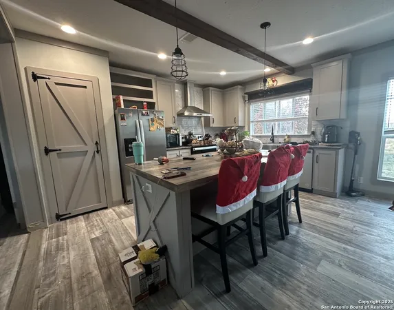 a dining room with furniture window and wooden floor