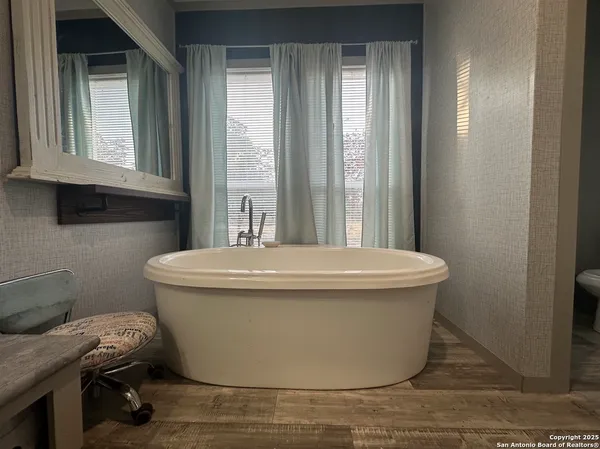 a view of a room with windows