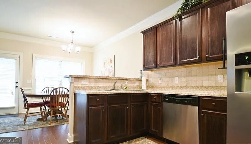 157 Putters Drive Athens, GA 30607 - Photo 12 of 24 a kitchen with a sink a table and chairs