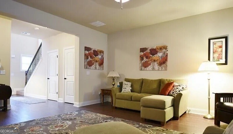 157 Putters Drive Athens, GA 30607 - Photo 16 of 24 a living room with furniture and wooden floor
