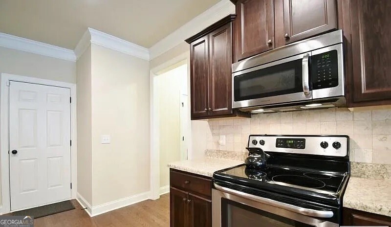 157 Putters Drive Athens, GA 30607 - Photo 17 of 24 a kitchen with a stove and a microwave