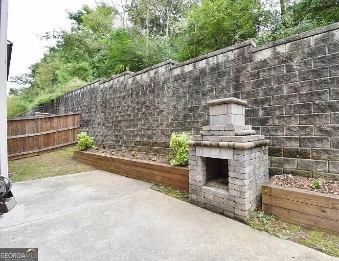 157 Putters Drive Athens, GA 30607 - Photo 23 of 24 a brick building with a bench in front of it