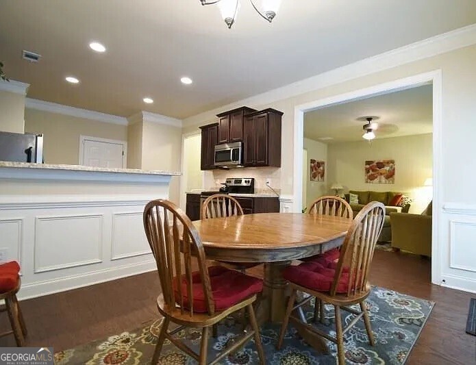 157 Putters Drive Athens, GA 30607 - Photo 3 of 24 a dining room with furniture and wooden floor