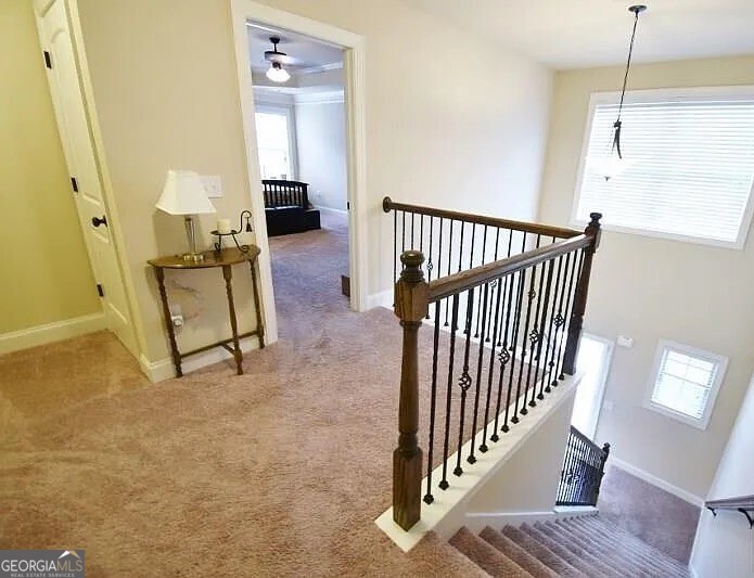 157 Putters Drive Athens, GA 30607 - Photo 7 of 24 a view of a hallway with wooden floor and staircase