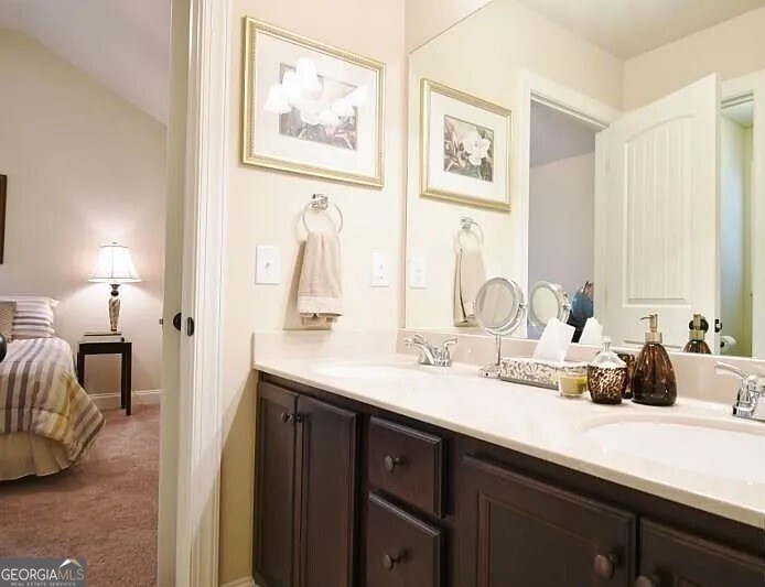 157 Putters Drive Athens, GA 30607 - Photo 9 of 24 a bathroom with a double vanity sink and a mirror