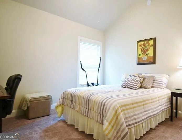 157 Putters Drive Athens, GA 30607 - Photo 10 of 24 a bedroom with a bed and a chair