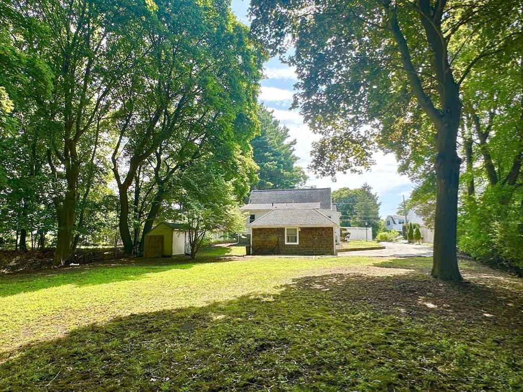 8 A Mellon Road Wellesley, MA 02482 - Photo 20 of 22 a view of a house with yard and sitting area