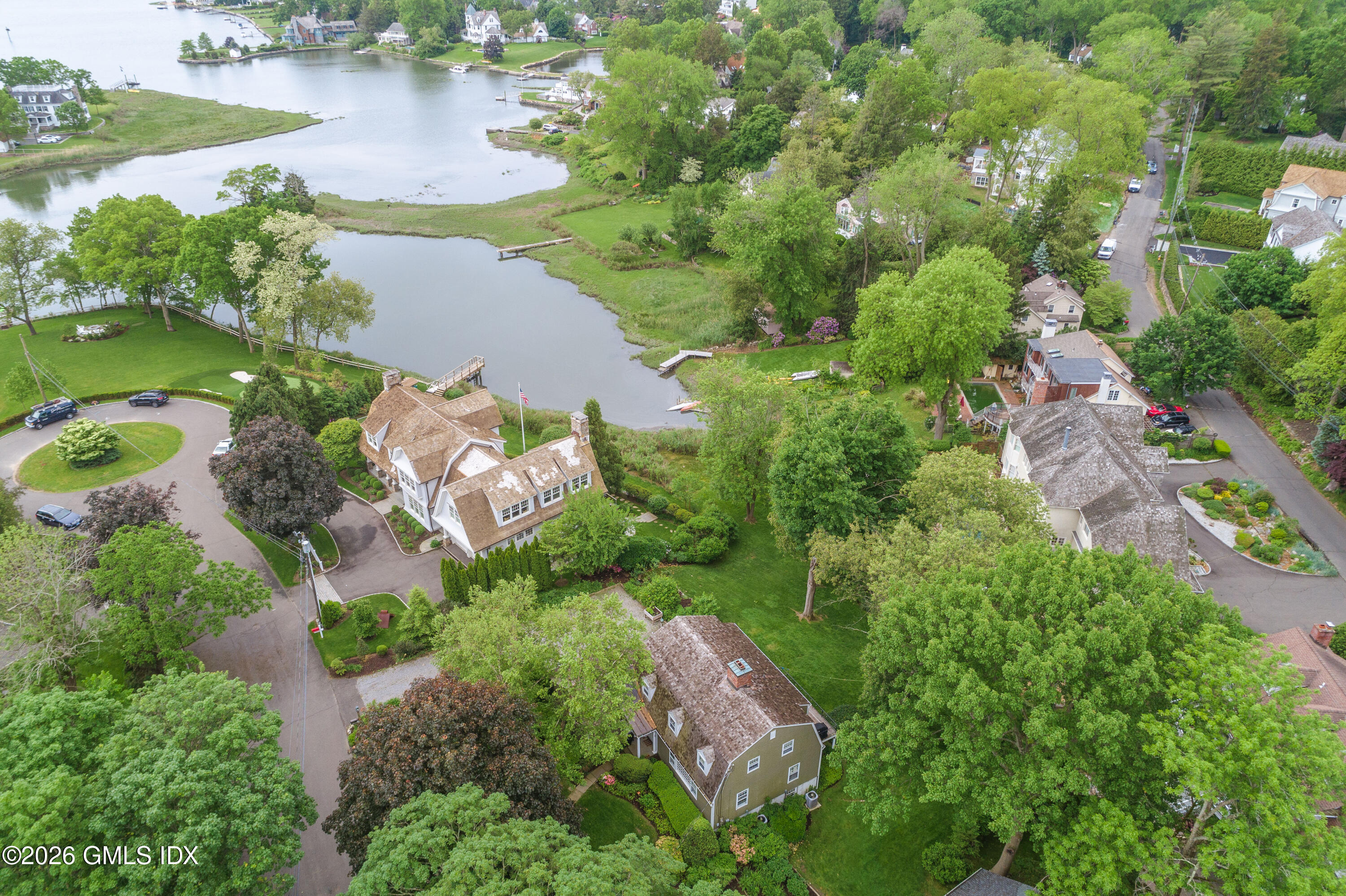 14 Shoal Point Lane Riverside, CT 06878 - Photo 2 of 30 an aerial view of ocean residential house with outdoor space and trees all around