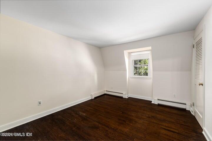 14 Shoal Point Lane Riverside, CT 06878 - Photo 26 of 30 an empty room with wooden floor and windows