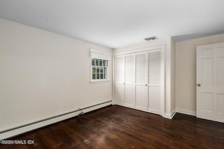 14 Shoal Point Lane Riverside, CT 06878 - Photo 27 of 30 an empty room with wooden floor and windows