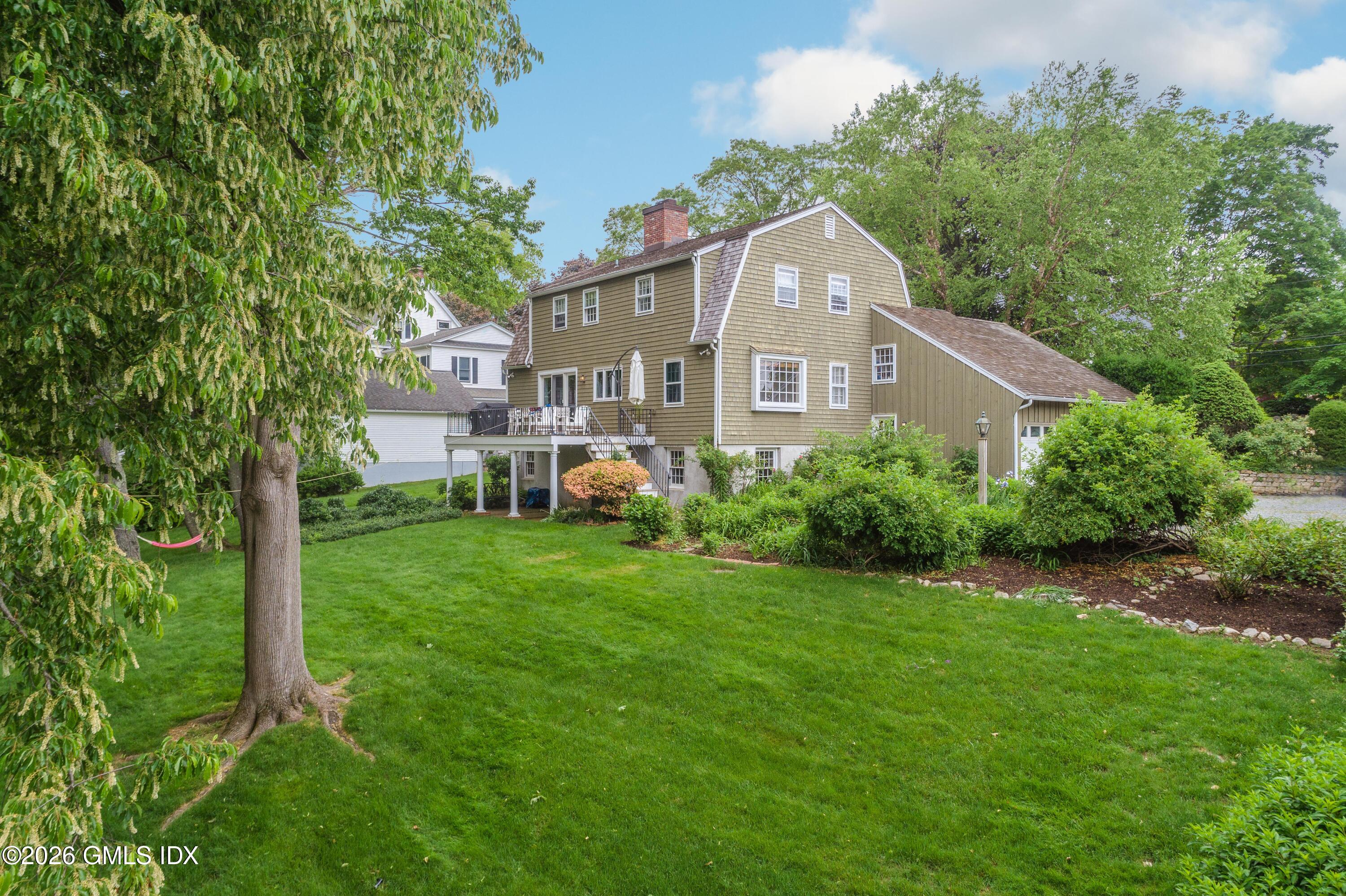 14 Shoal Point Lane Riverside, CT 06878 - Photo 4 of 30 a front view of a house with garden