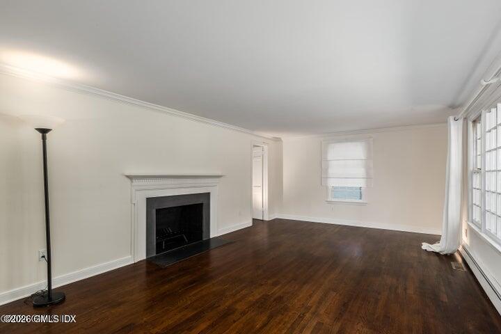 14 Shoal Point Lane Riverside, CT 06878 - Photo 6 of 30 an empty room with wooden floor fireplace and windows