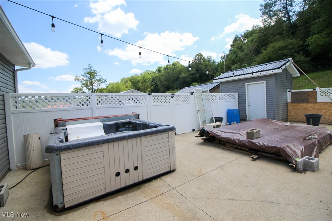 1798 Campbell Road Southwest New Philadelphia, OH 44663 - Photo 34 of 50 View of patio / terrace featuring a hot tub