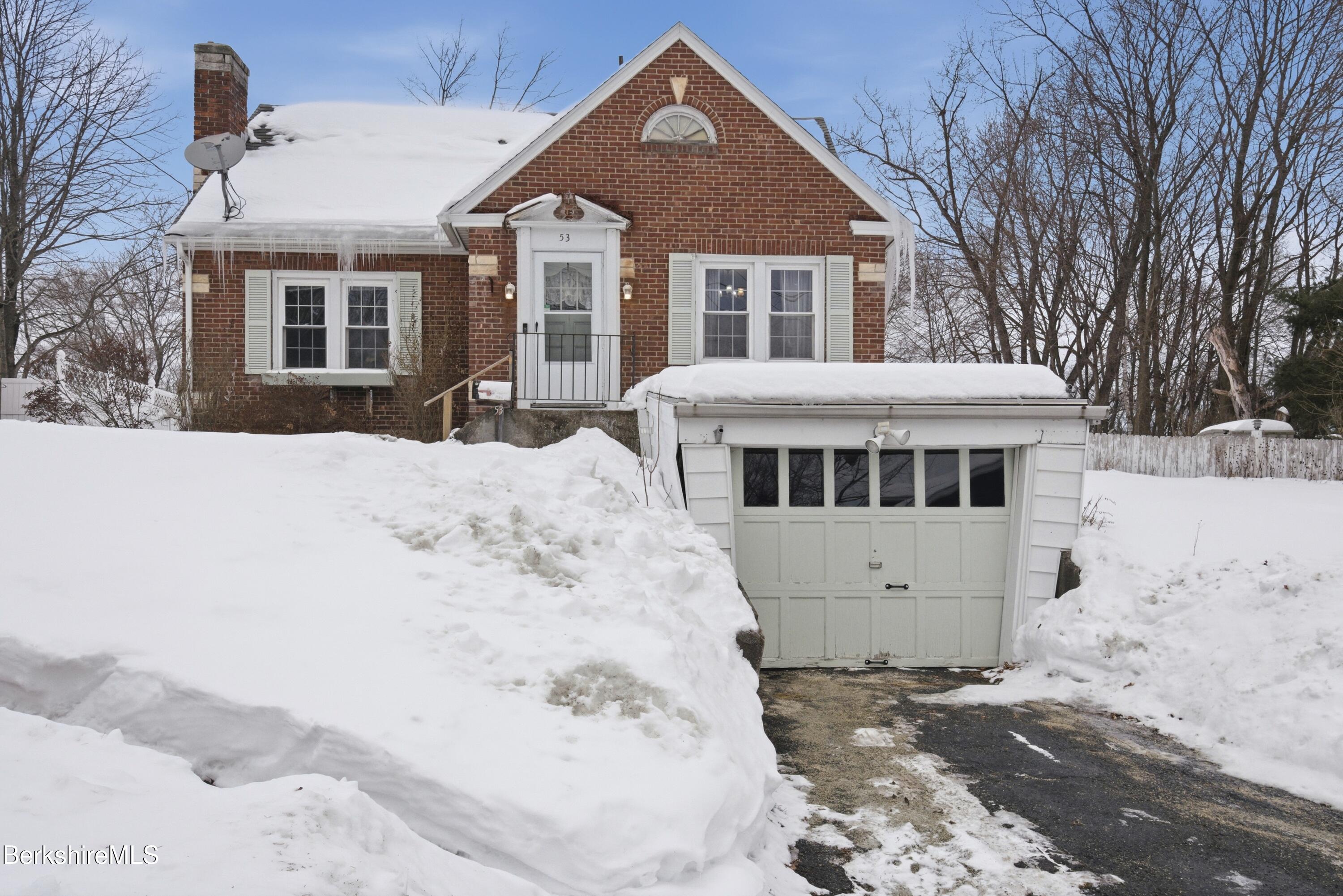53 Edison Avenue Pittsfield, MA 01201 - Photo 36 of 45 a front view of a house with a yard covered in snow