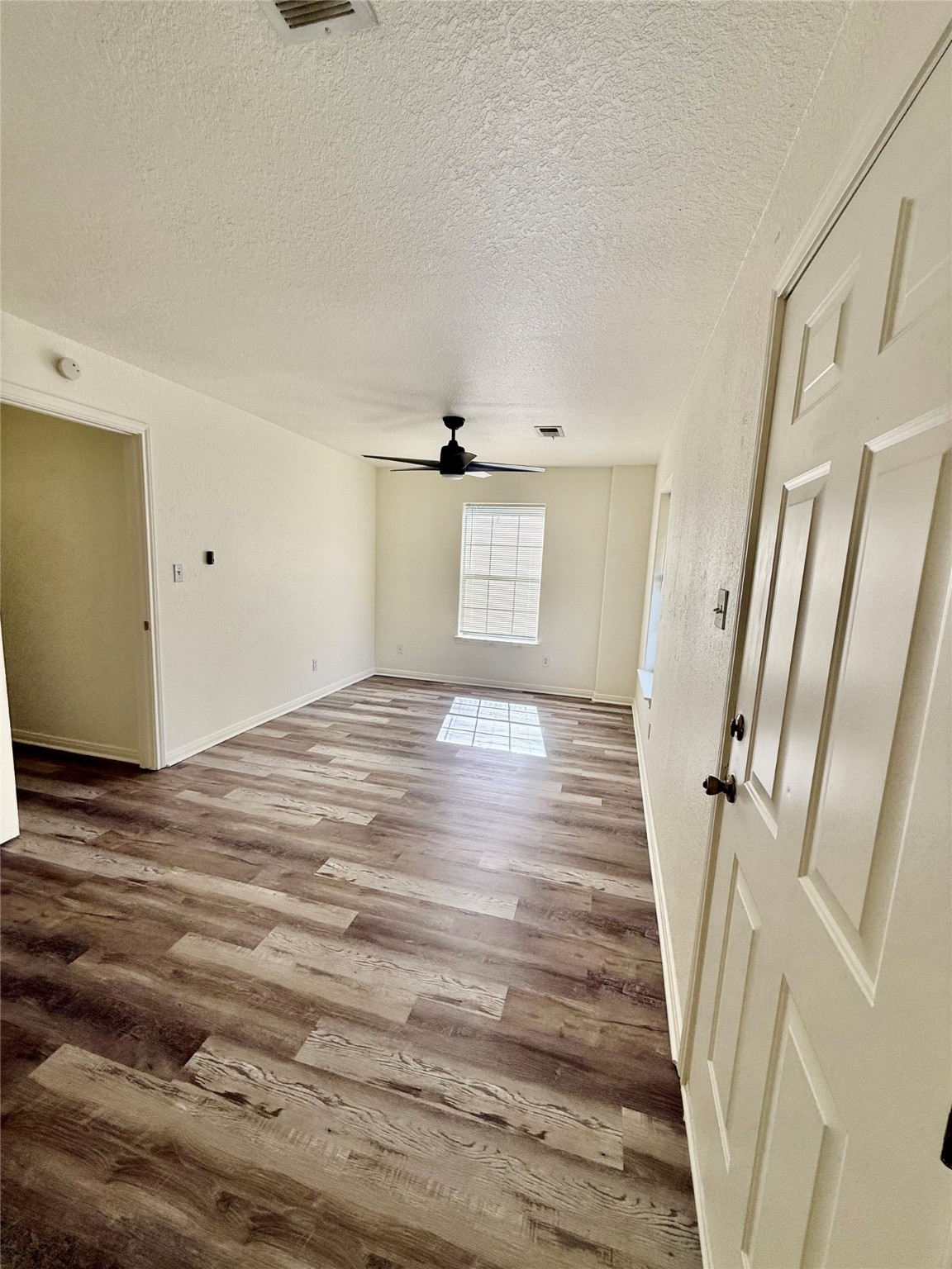 827 Algoa-Friendswood Road Alvin, TX 77511 - Photo 6 of 9 a view of a room with wooden floor and staircase