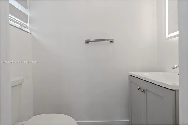 a bathroom with a sink and toilet
