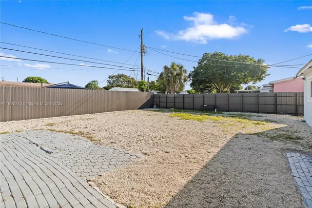 a view of a backyard of a house