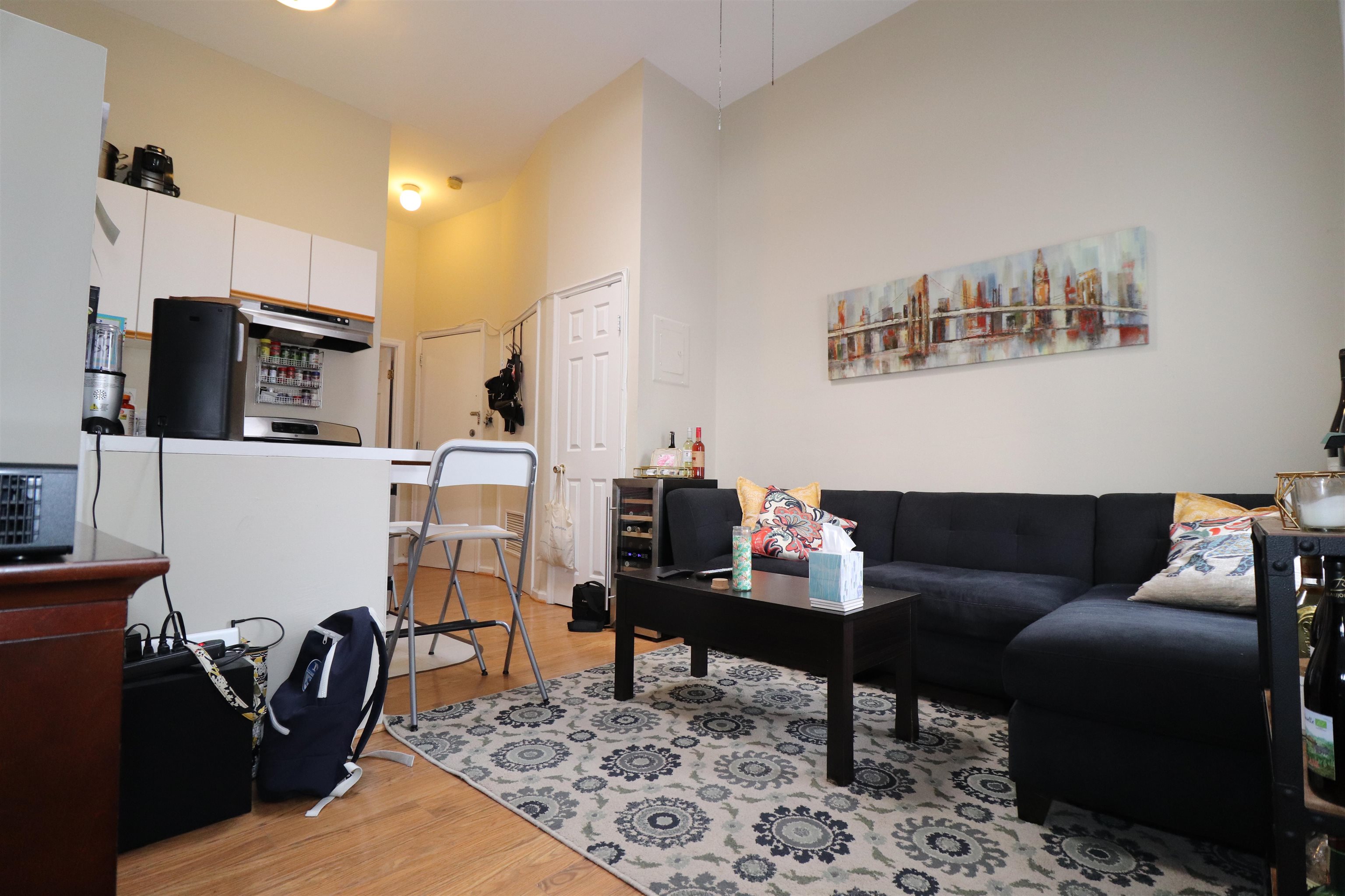 308 8th Street, Unit 2 Hoboken, NJ 07030 - Photo 4 of 8 a living room with furniture and a rug