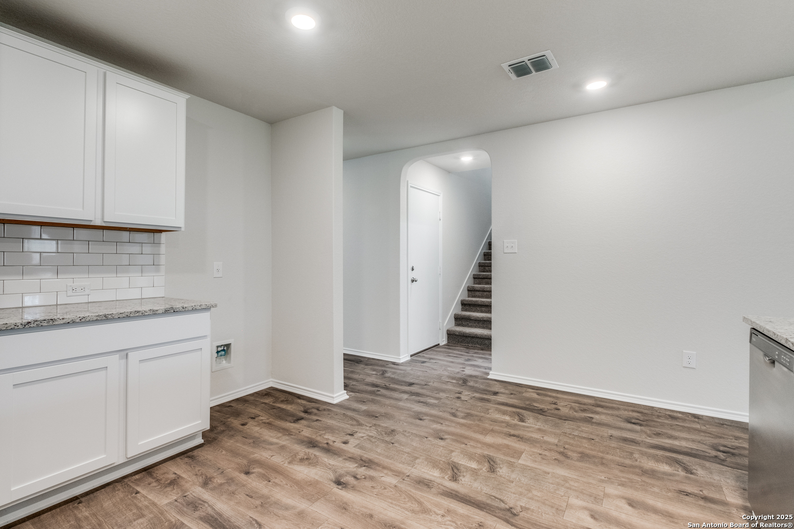 29523 Copper Gate Bulverde, TX 78163 - Photo 6 of 25 a view of a kitchen with wooden floor and staircase