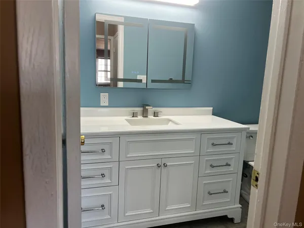 a sink with a mirror