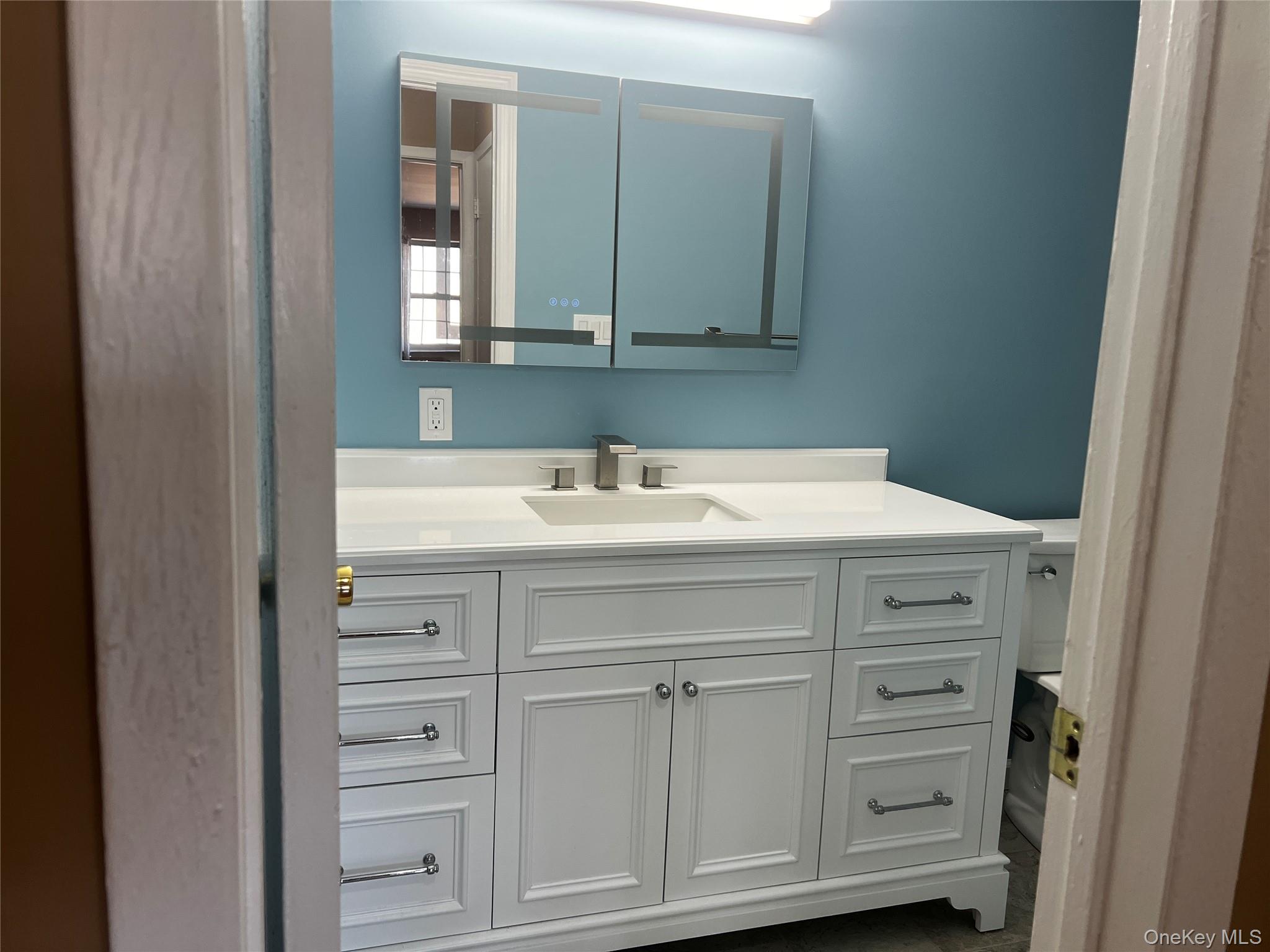 1840 Crompond Road, Unit 7C6 Peekskill, NY 10566 - Photo 12 of 16 a sink with a mirror