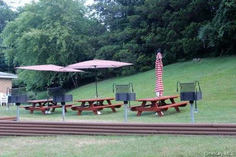 a backyard view of a house with wooden floor portable swimming pool and outdoor seating