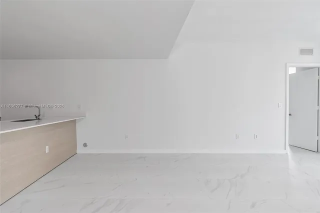 a view of a utility room with a sink