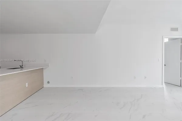 a view of a utility room with a sink