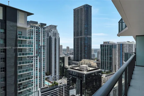 a view of a balcony with a floor to ceiling window
