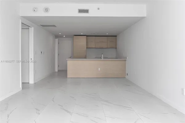 a view of kitchen and white cabinet