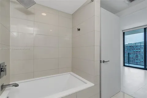 a bathroom with a double vanity sink and mirror