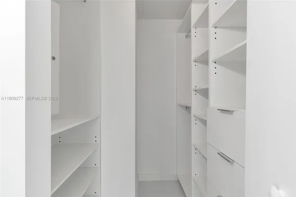a view of empty room with floor to ceiling window