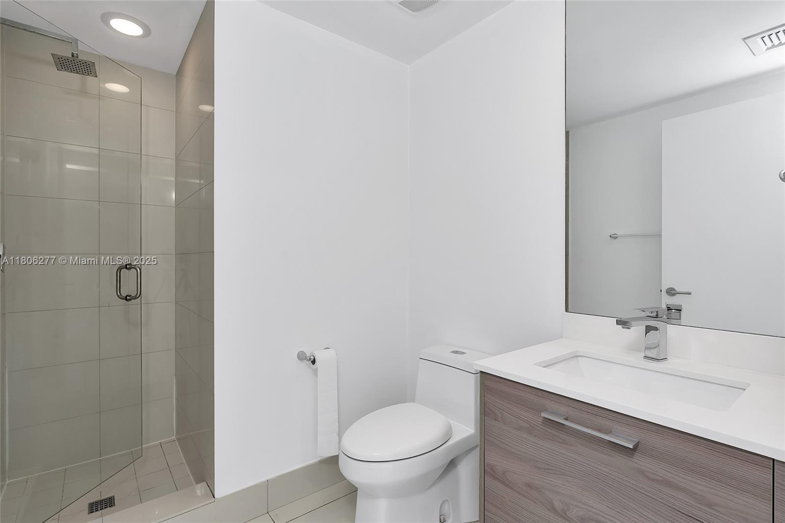 1300 South Miami Avenue, Unit 3211 Miami, FL 33130 - Photo 35 of 38 a bathroom with a sink a toilet and shower