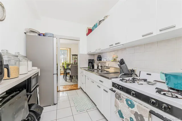 a kitchen with a sink appliances and cabinets