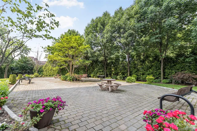 a view of a backyard with sitting area