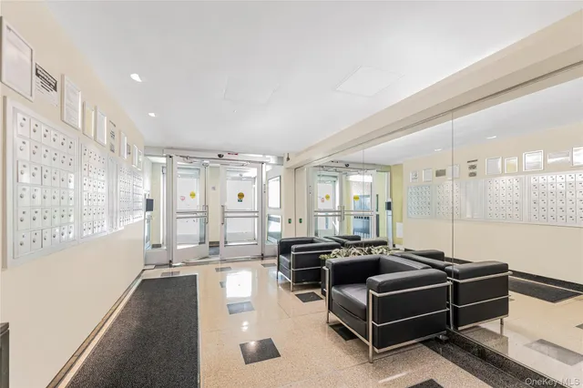 a living room with furniture gym equipment and a large window