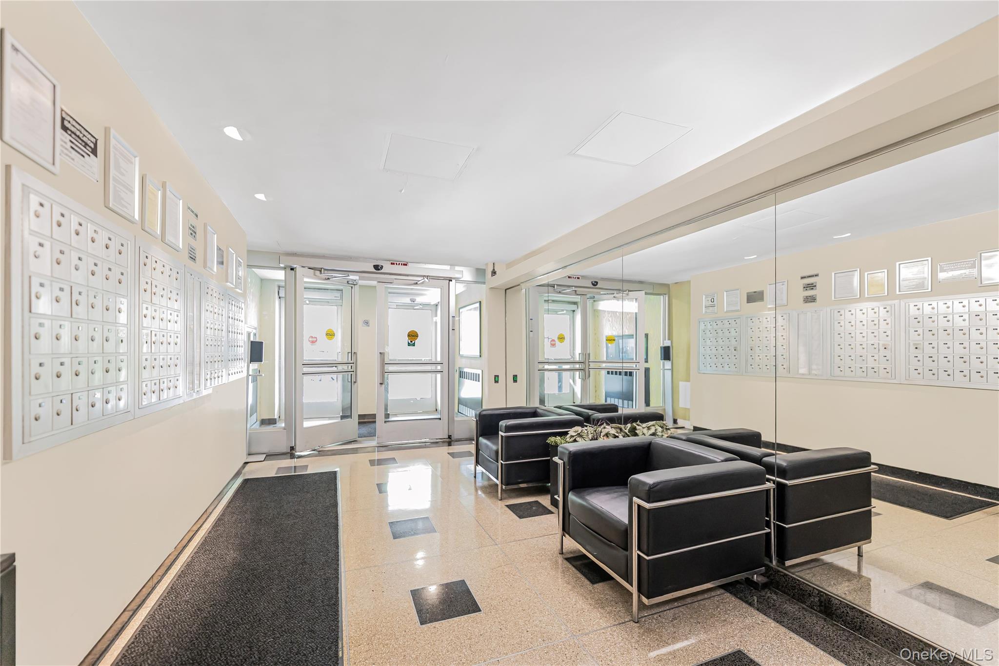 2 Fordham Hill Ovl, Unit 2F Bronx, NY 10468 - Photo 21 of 27 a living room with furniture gym equipment and a large window